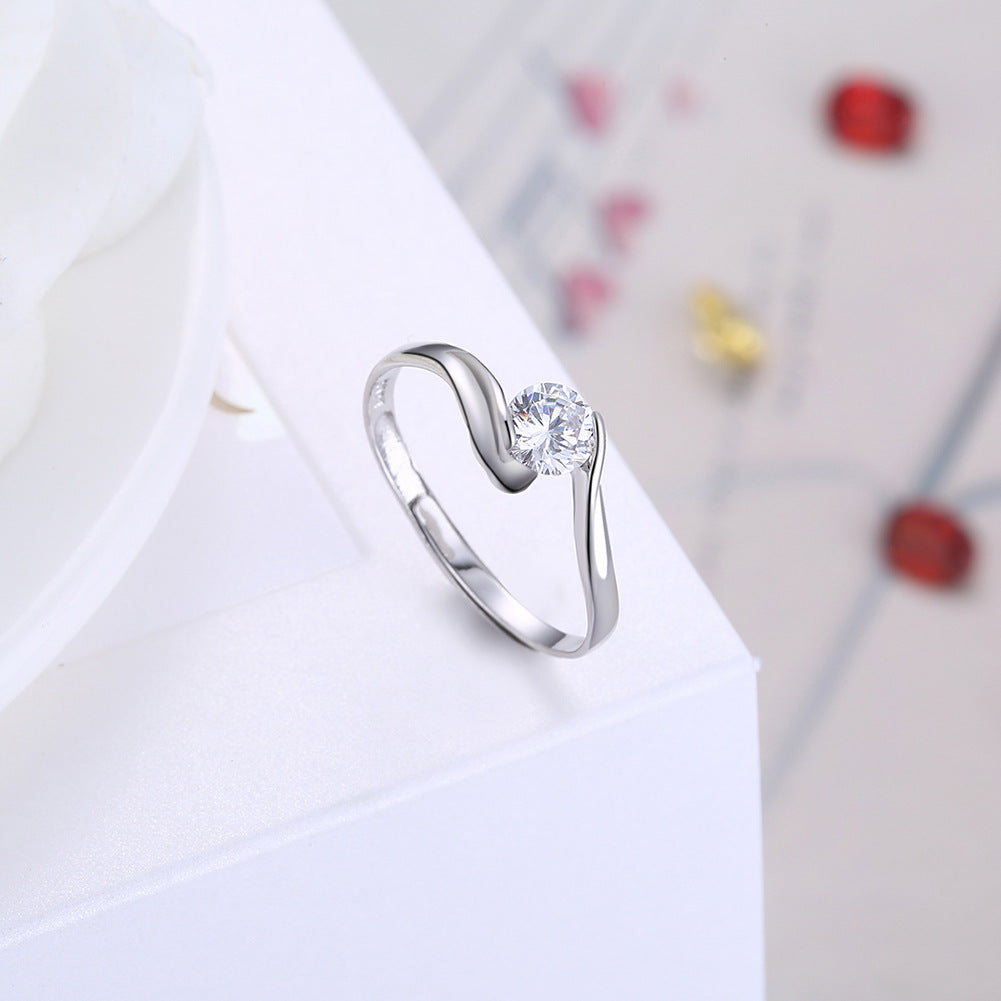 Aurore | Anello Solitario con Incastonatura a Spirale