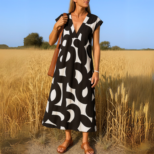 Tirzah | Flowy V-neck dress with geometric design